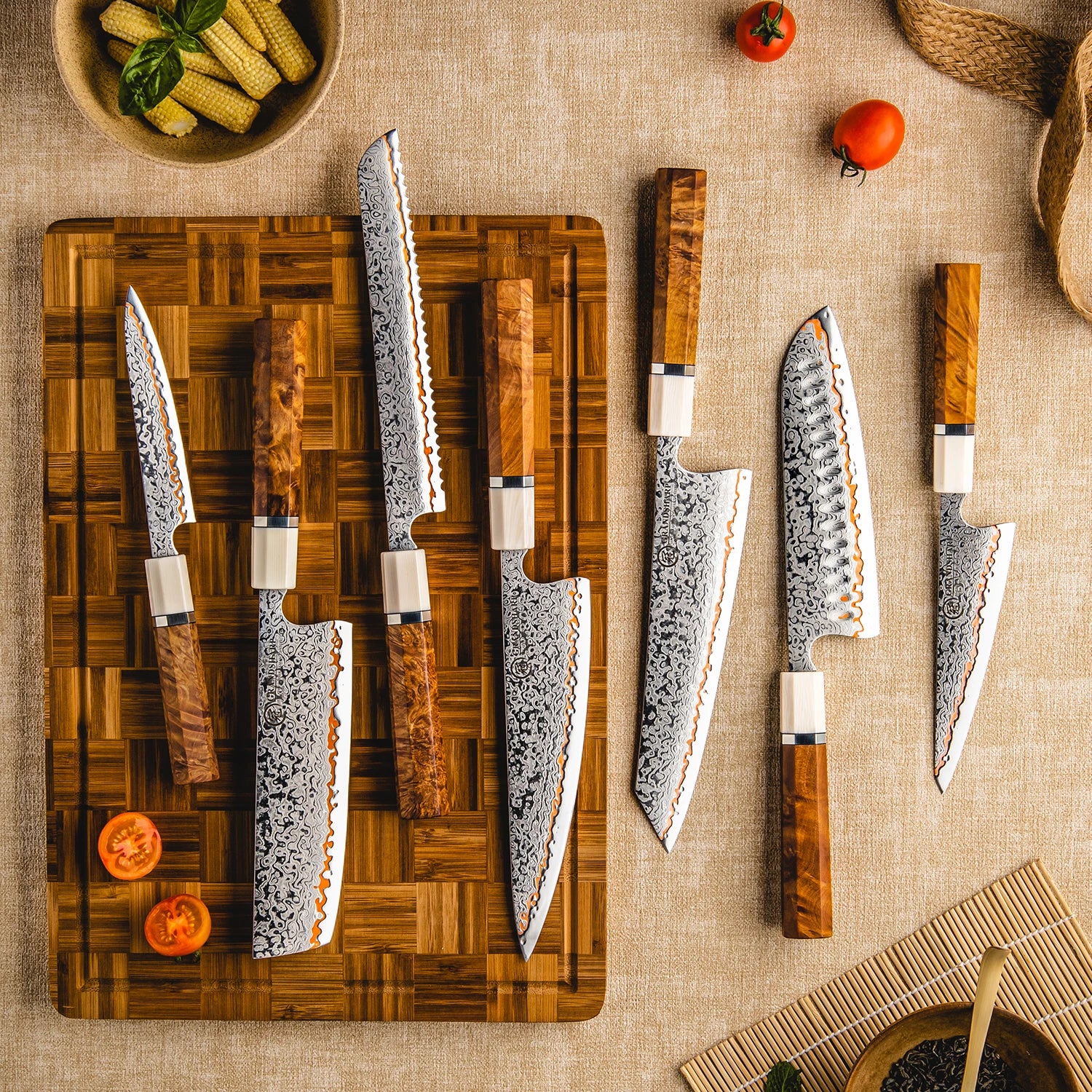 Set of patterned chef knives with wooden handles on a cutting board, surrounded by vegetables.