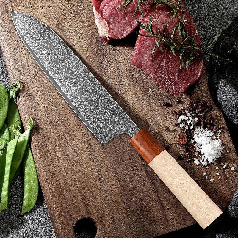 Damascus steel kitchen chef knife with wooden handle on cutting board, meat and spices nearby